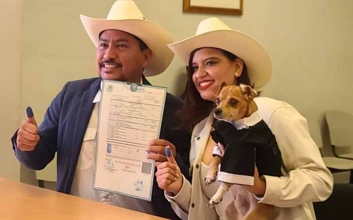 Puppy signs as a witness at his owners’ wedding